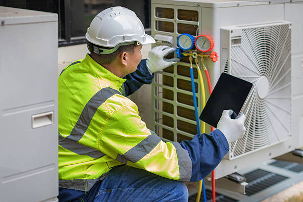Professional Air Conditioning Repair technician working in National Stock Yards, IL